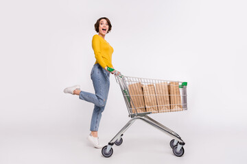 Full body photo of impressed brunette millennial lady do shopping wear shirt jeans isolated on grey...