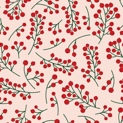 Seamless christmas pattern with rowan berries and green branches on a pale pink background. Autumn vector illustration background for surface design projects.