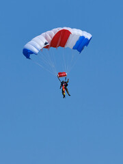 Parachutist in flight from back side