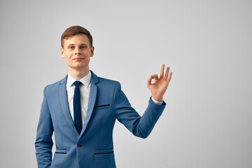 Cheerful business man gesturing with hands success manager office work