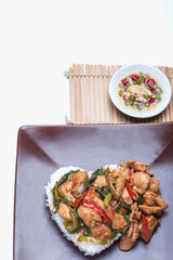 Stir fried chicken with basil over rice