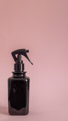 black spray diffuser on pink background