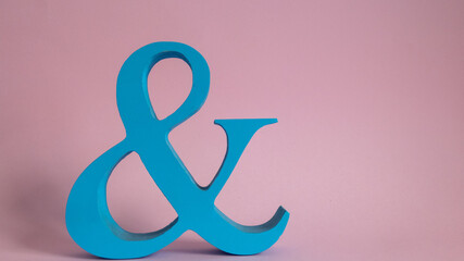 minimalistic blue ampersand on pink background