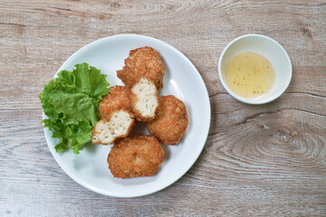 crispy fried mashed shrimp cake coating flake bread and flour dipping with sweet plum sauce