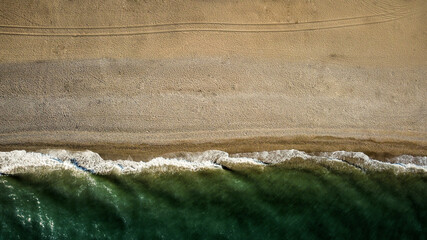 Empty beach coastline in the autumn aerial drone view