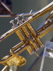 Naklejka na ściany i meble Close-up selective focus view of the valves keys of a brass trumpet