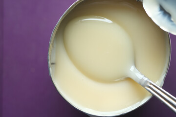 condensed milk in a bowl close up,