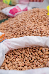 Pistachio in bag in Turkish market. Selected roasted and raw nuts in scarlup.