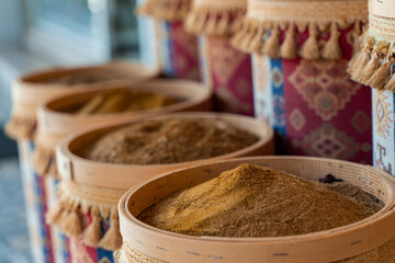 Assortment of Turkish spices and herbs in wooden bowls. Turkish market spices such as saffron, sumac and thyme. Cumin, rosemary and isot.