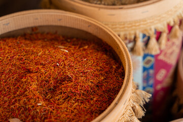 Assortment of Turkish spices and herbs in wooden bowls. Turkish market spices such as saffron, sumac and thyme. Cumin, rosemary and isot.