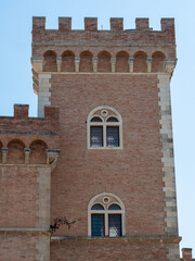 Fototapeta na wymiar Embattled Tower of the Medieval Castle at the Entrance to the Village of Bolgheri