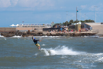 Kitesurfing During a Windy Day with a Very Rough Sea