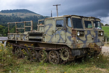 Fototapeta na wymiar old rusty Soviet military tracked all-terrain vehicle