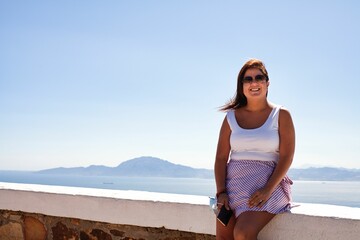 girl enjoying summer days in the southern part of spain and watching sunsets
