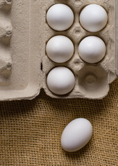 Overhead view of eggs on rustic burlap