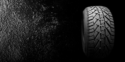  black isolation rubber tire, on the snow backgrounds