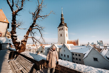 male tourist outdoors in winter in the old town of Tallinn.Estonia