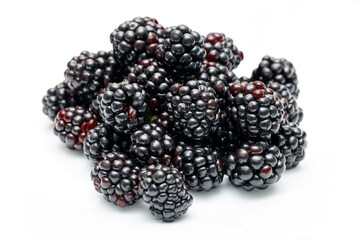 Ripe blackberries on a white plate. Useful forest fruits. Super food. Concept of healthy eating. top view. Close-up. Macro. Blackberry berries with water drops. Flat lay