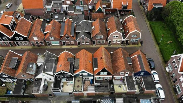aerial flying above the typical dutch houses of volendam showing the typical lines