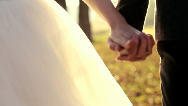 marry me today and everyday newlywed couple holding hands shot in slow motion