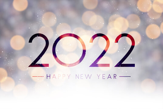 Fogged glass 2022 sign on colorful bokeh background.