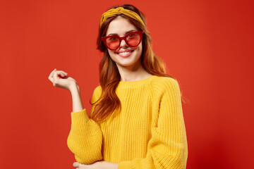 woman holding hair in red glasses fashion studio retro style