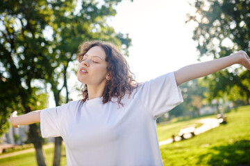 A cute young girl feeling peaceful and relaxed