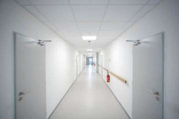empty clean and white corridor in modern medical interior - obrazy, fototapety, plakaty