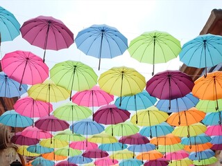 Fototapeta na wymiar colorful umbrellas on sky background