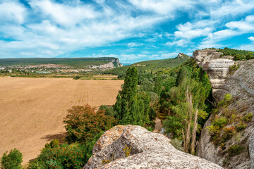Fototapeta na wymiar Beautiful summer landscape with rocks and views of the green hills of the valley, mountain landscape in the Crimea