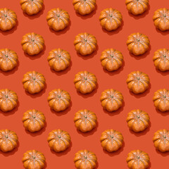 Photo of an orange pumpkin with shadow pattern isolated on dark orange background