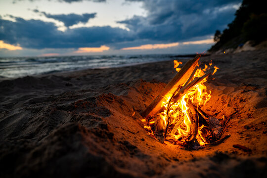 Bonfire burning in sand on the beach