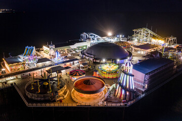 Fun Fair at the End of Brighton Palace Pier at Night Aerial View