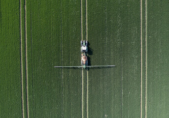 Tractor Spraying Controversial Glyphosate on Farmland