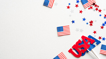 Fototapeta na wymiar Happy USA holidays banner design. Flags of America, confetti, decorations on white background.