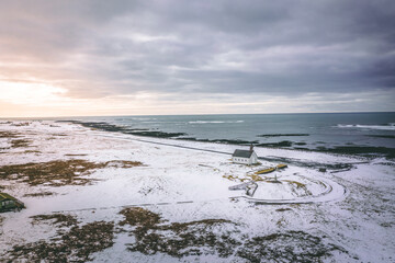 An Isolated Church in Snowy Conditions Next to the Sea
