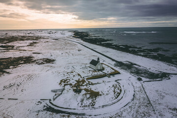 An Isolated Church in Snowy Conditions Next to the Sea