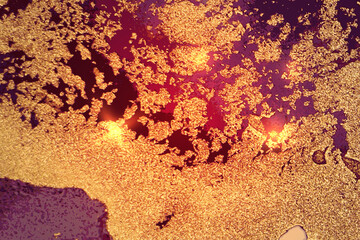Dark gold and purple abstract pattern with marble texture and sparkles. Vector background in alcohol ink technique with glitter. Template for banner, poster design. Fluid art painting