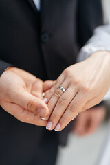 Picture of man and woman with wedding ring. holding hands