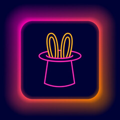 Glowing neon line Magician hat and rabbit ears icon isolated on black background. Magic trick. Mystery entertainment concept. Colorful outline concept. Vector