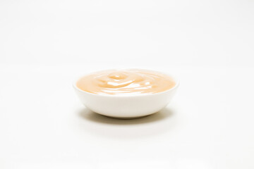 Mushroom sauce in a bowl isolated on white background.