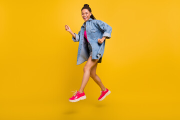 Full body profile side photo of young black girl happy positive smile jump go walk isolated over yellow color background