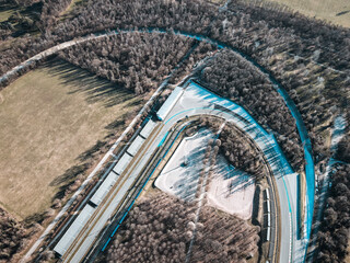 Aerial view of The Autodromo Nazionale of Monza, that is a race track located near the city of Monza, north of Milan, in Italy. Birds eye and drone shot of the circuit of Monza, near Villa Reale.