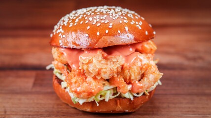 Delicious shrimp burger on the wooden table