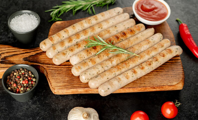 grilled bavarian sausages on a stone background