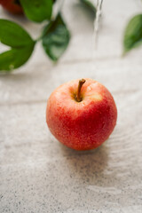 red apple in the sink with water