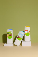 Eco friendly Bottle and tube with natural skincare cosmetics, creams or oils on light background. Plant-based beauty products