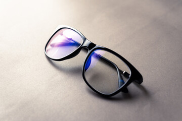 black frame blue light blocking technology anti glare spectacles glasses on grey background