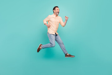Fototapeta na wymiar Full size profile side photo of smiling man running fast speed in air traveling tourist isolated on teal color background