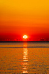 Beautiful Red Sunset over the Sea Horizon with clouds, Nature Background